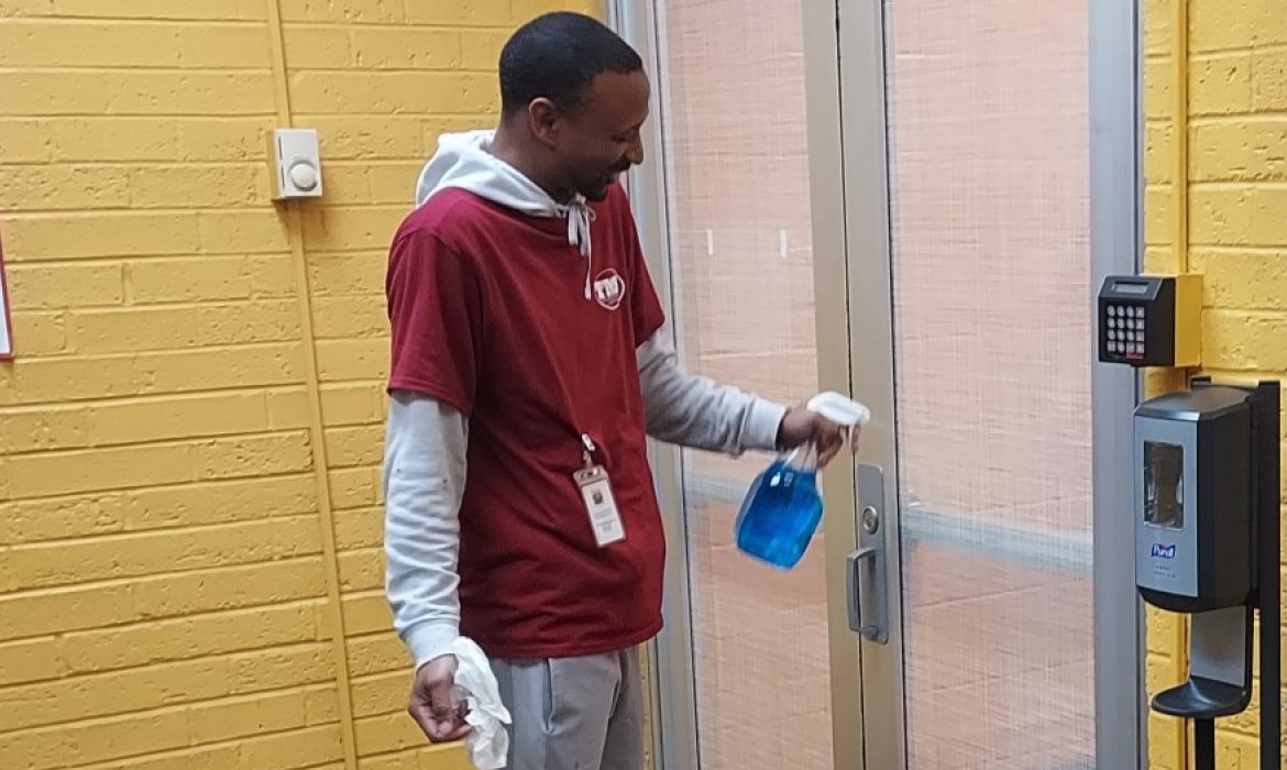 man cleaning windows