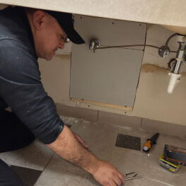 Man changing a light bulb. 